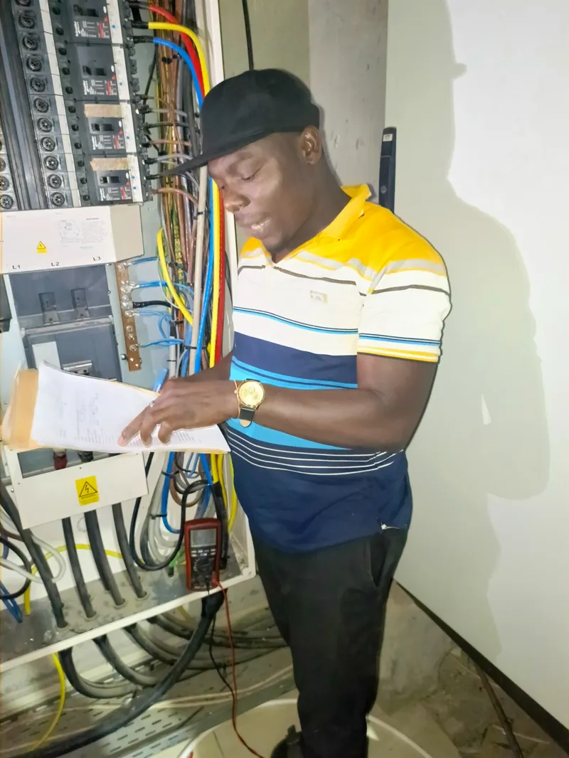 ESCA Tech electrician inspecting an electrical installation